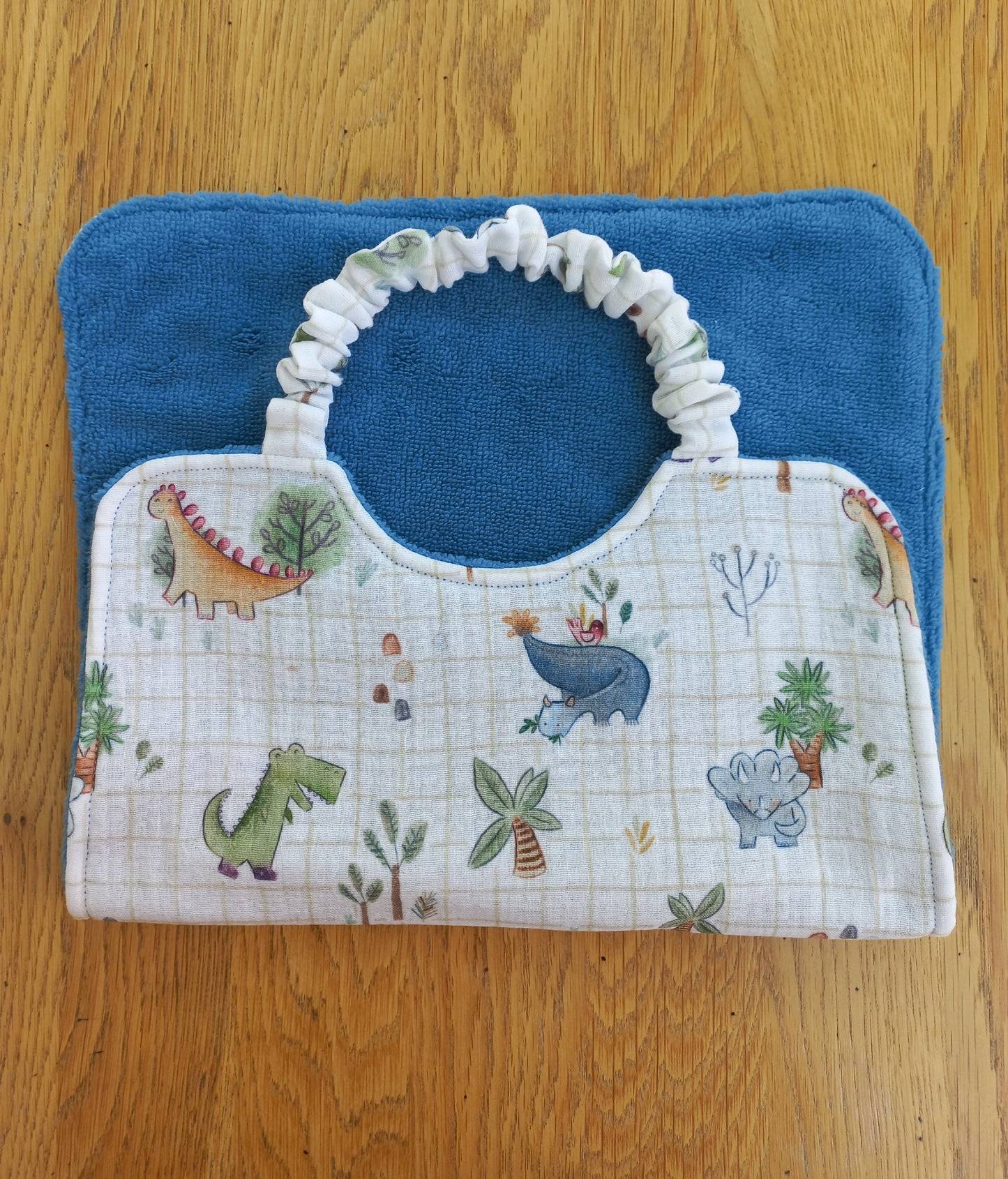 Bavoir à élastique double gaze dinosaures