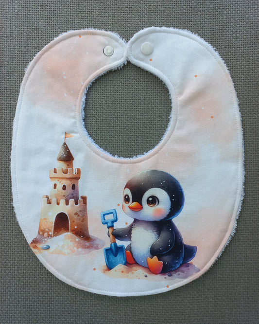 Bavoir bébé pingouin à la plage