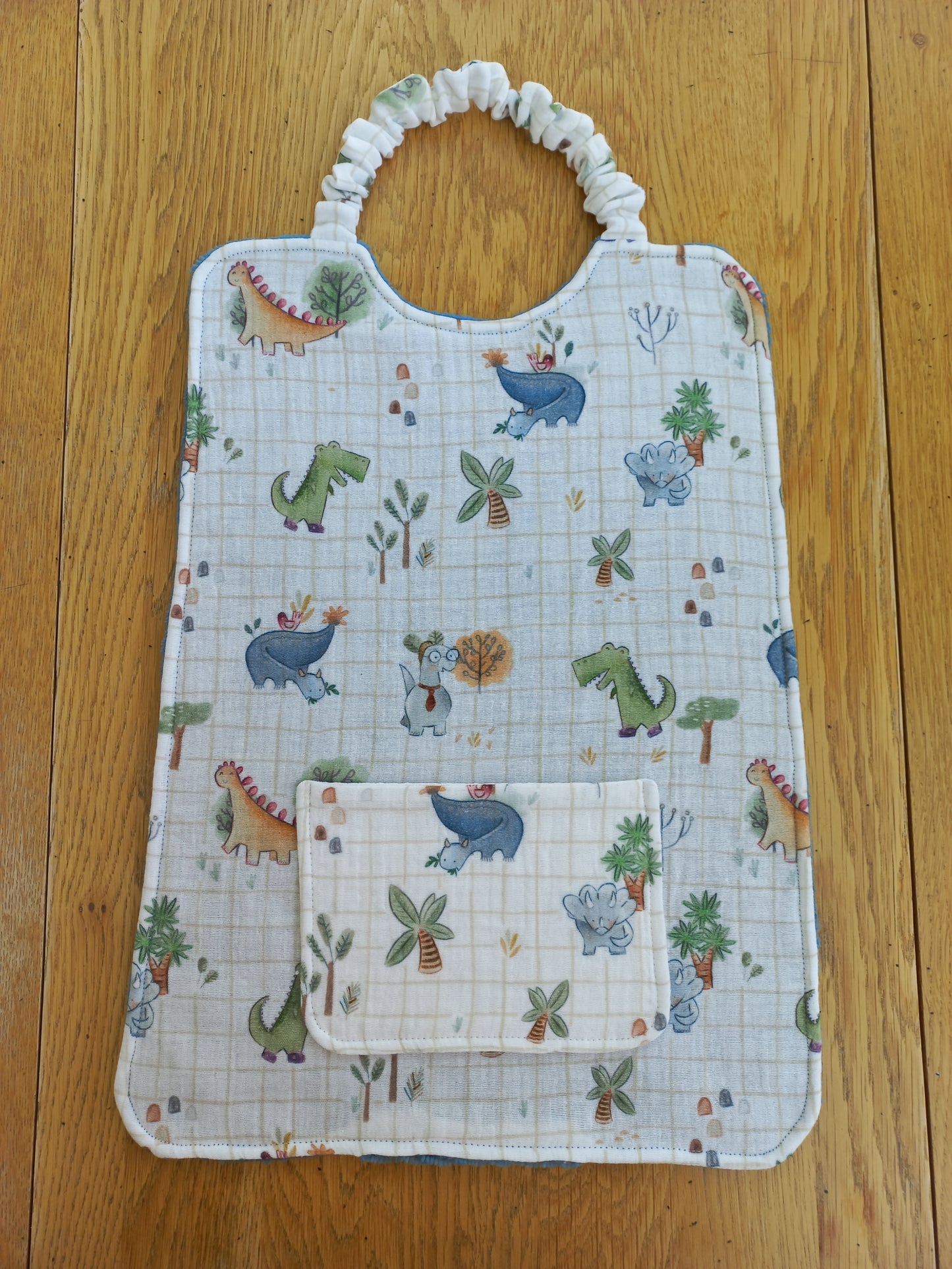 Bavoir à élastique double gaze dinosaures