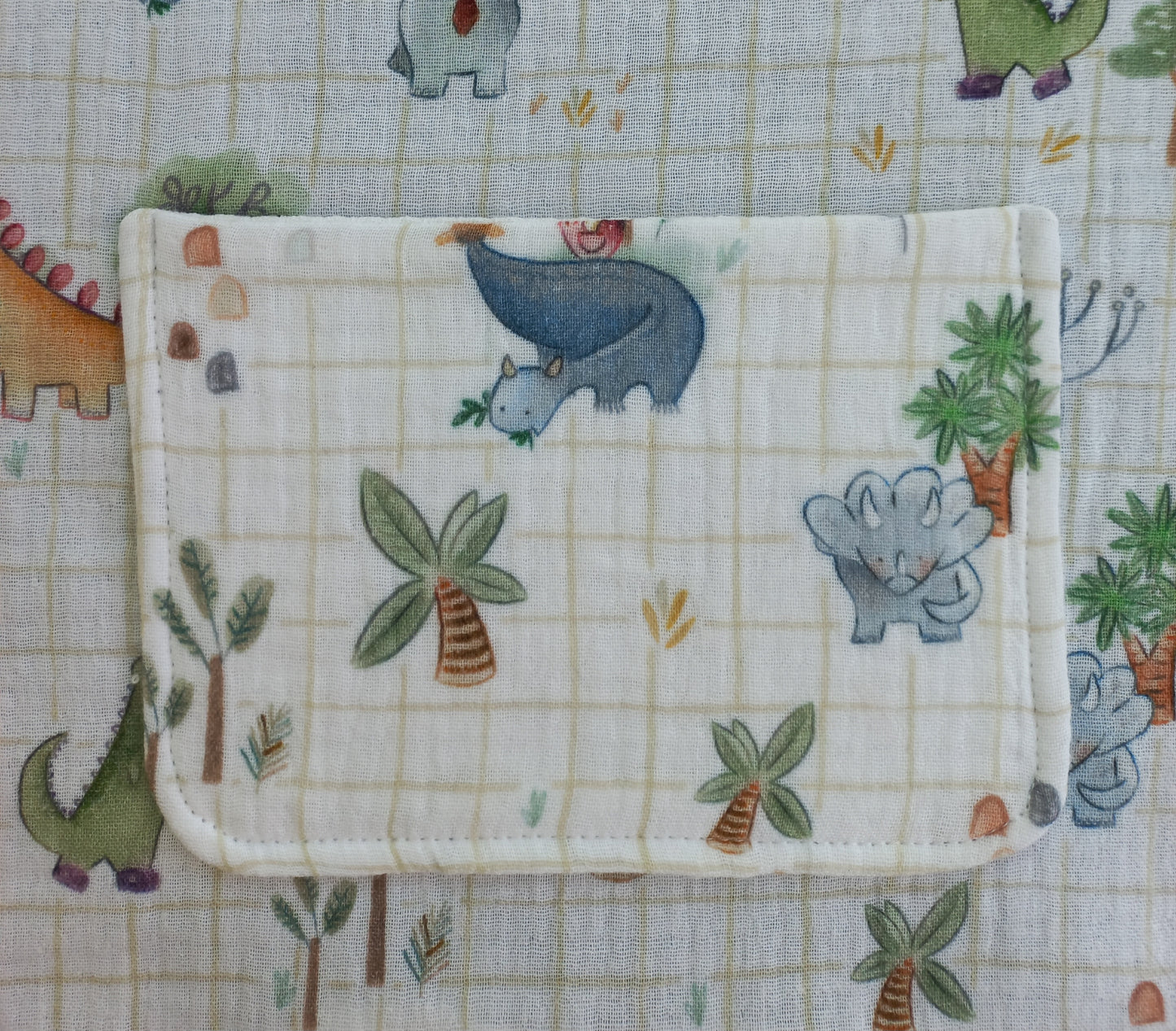 Bavoir à élastique double gaze dinosaures